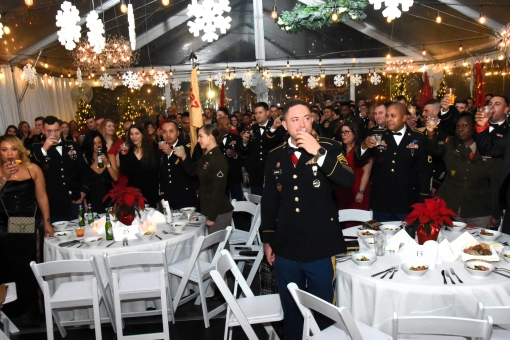 New York Army National Guard Soldiers assigned to the 1st Battalion, 258th Field Artillery Regiment and their guests raise a glasss during the battalion's annual St. Barbara's Ball on Saturday, Dec. 2, at the Sanctuary Roosevelt Island in New York City. T