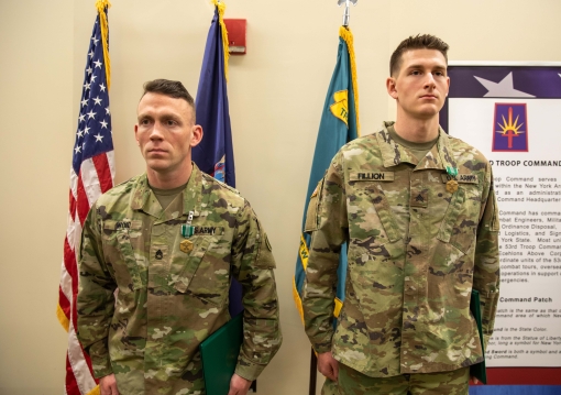 The winners of the 2024 New York Army National Guard Best Warrior Competition stand at attention after receiving the Army Commendation Medal in recognition of their accomplishment at Camp Smith Training Site in Cortlandt Manor New York on April 19 2024. T