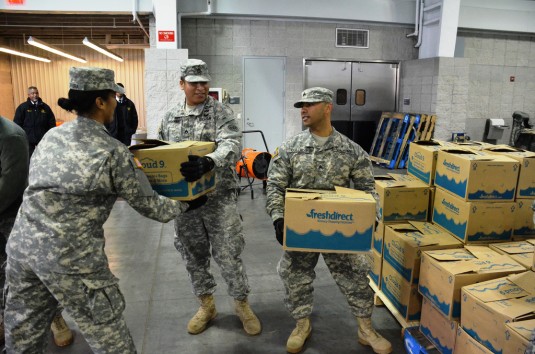 Troops Assist in Holiday Meal Distribution